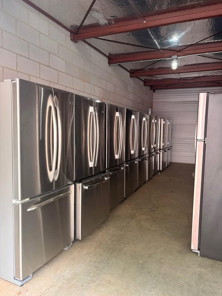 Row of French door stainless steel refrigerators